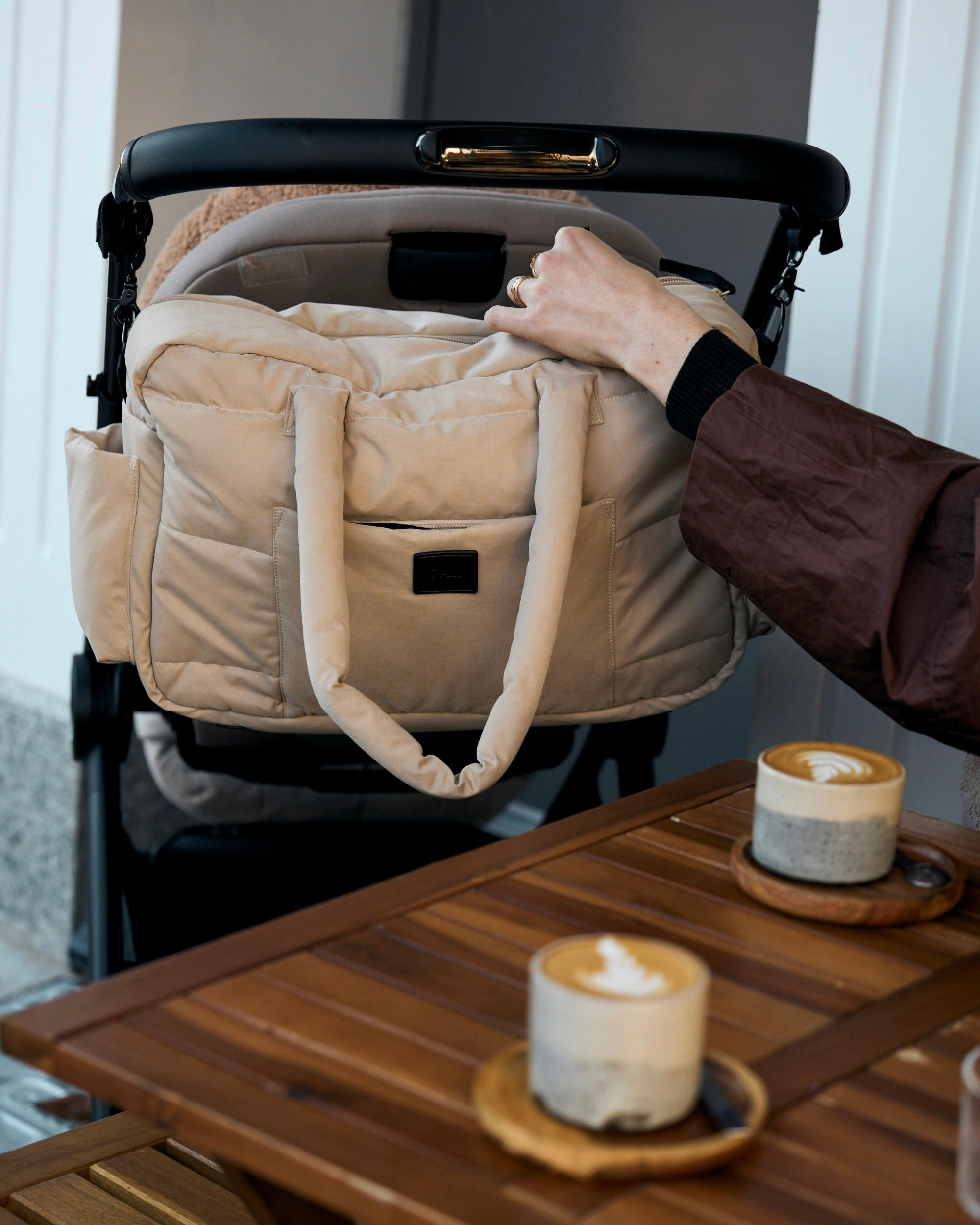 diaper bag on coffee shop table